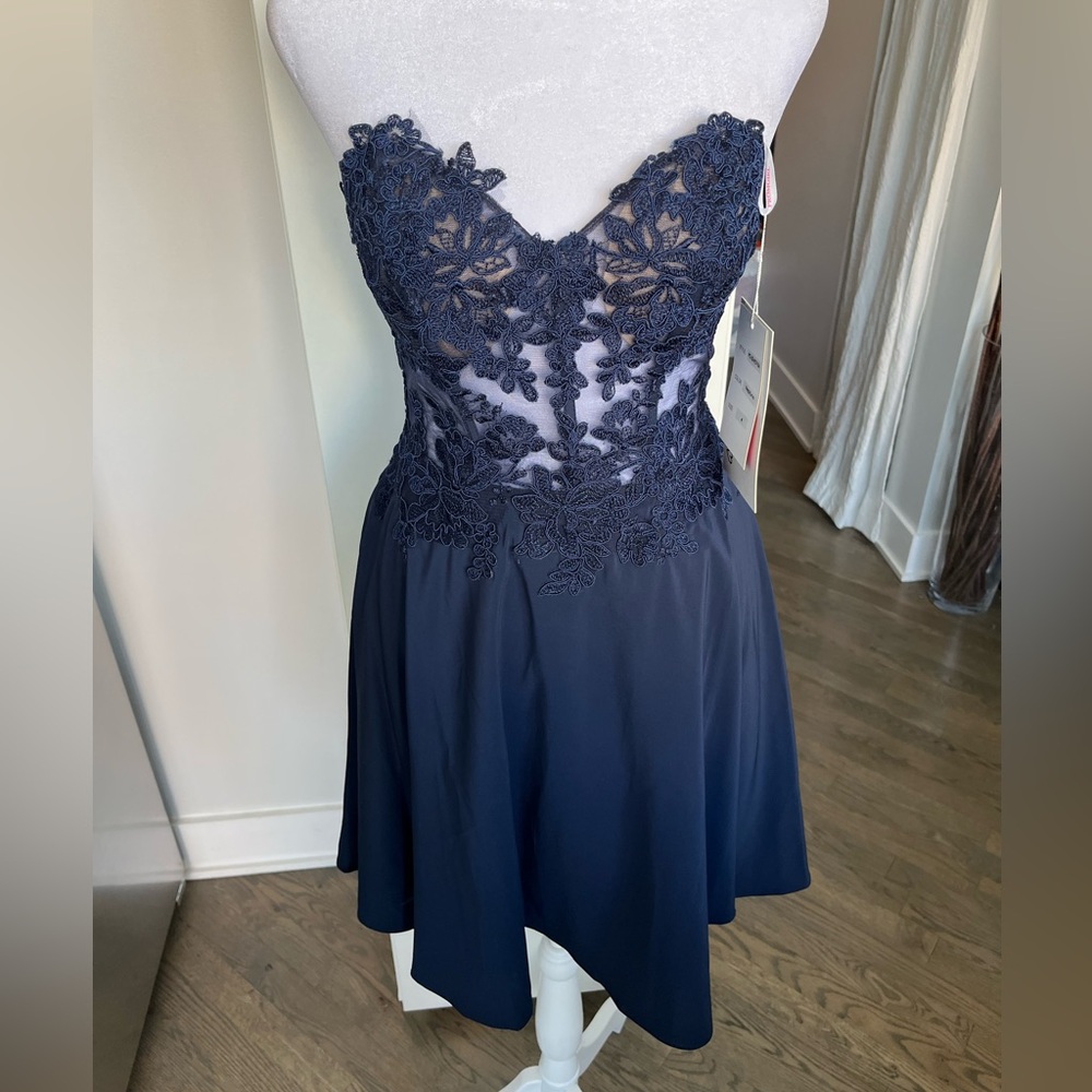 NWT. Prom Girl corset short dress in navy blue. Size 4